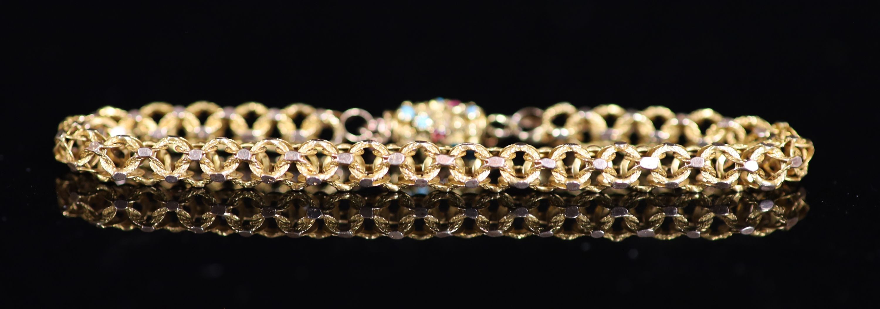 A 19th century gold triple ring link bracelet, with cabochon turquoise and garnet set barrel shaped clasp